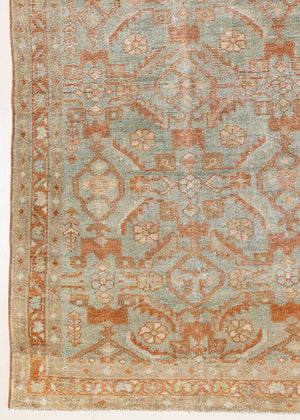 Marisa is a Persian Malayer runner with a beautiful palette of blues and terracotta and a wonderful patina. The pretty floral motif repeats throughout the length of the runner.
