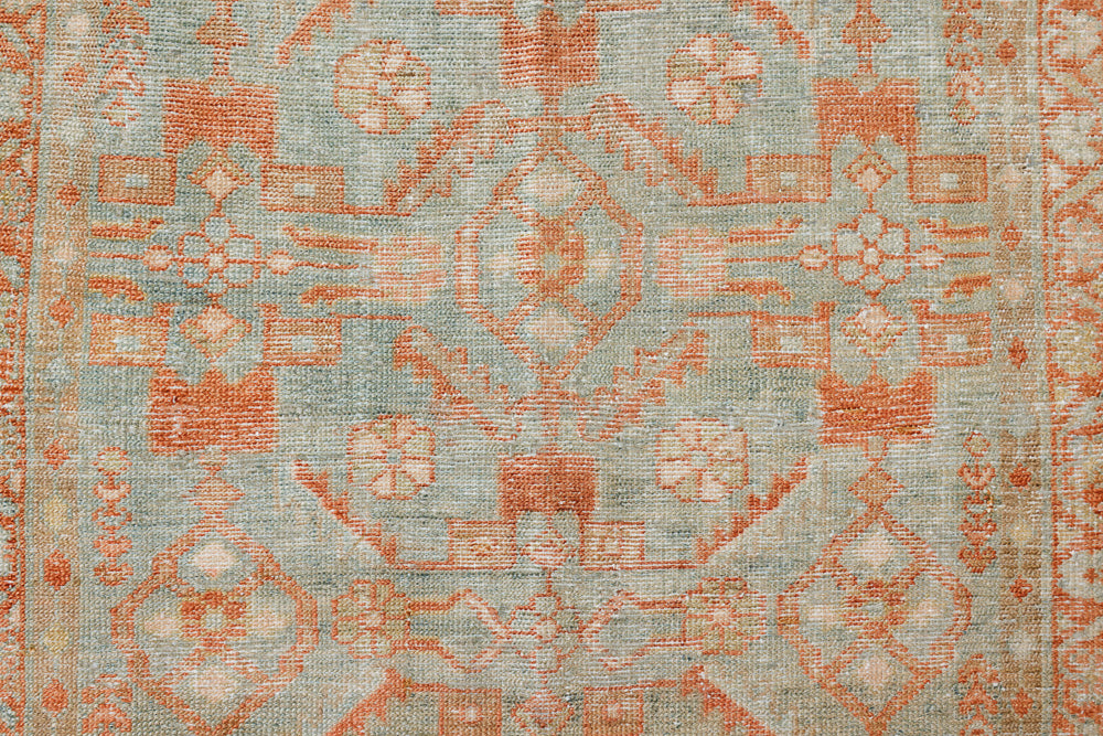 Marisa is a Persian Malayer runner with a beautiful palette of blues and terracotta and a wonderful patina. The pretty floral motif repeats throughout the length of the runner.