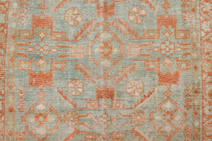 Marisa is a Persian Malayer runner with a beautiful palette of blues and terracotta and a wonderful patina. The pretty floral motif repeats throughout the length of the runner.