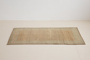 Jemima is a vintage rug handwoven in Turkey approximately 80 years ago. This rug features the classic boteh or paisley design and a refined, soft colour palette.