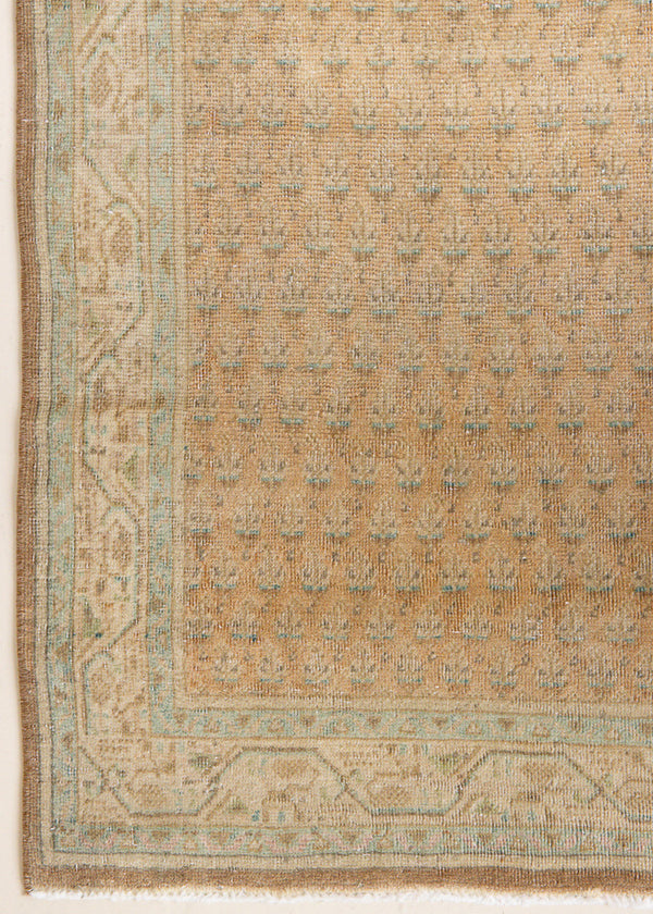 Jemima is a vintage rug handwoven in Turkey approximately 80 years ago. This rug features the classic boteh or paisley design and a refined, soft colour palette.