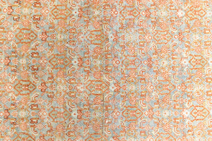 Tabriz rugs are celebrated for their incredible precision, calm symmetry and intricate designs. This piece features a stunning all over Herati pattern and an incredible palette of soft terracotta and sky blue.