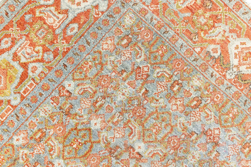 Tabriz rugs are celebrated for their incredible precision, calm symmetry and intricate designs. This piece features a stunning all over Herati pattern and an incredible palette of soft terracotta and sky blue.