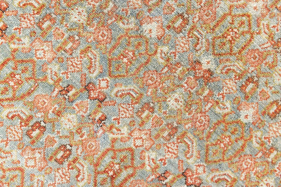 Tabriz rugs are celebrated for their incredible precision, calm symmetry and intricate designs. This piece features a stunning all over Herati pattern and an incredible palette of soft terracotta and sky blue.