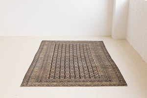 Liberty is a handmade Malayer rug, woven in the North West of Persia. This vintage carpet features a beautifully intricate repeating design and a rare colour palette.