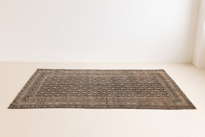 Liberty is a handmade Malayer rug, woven in the North West of Persia. This vintage carpet features a beautifully intricate repeating design and a rare colour palette.