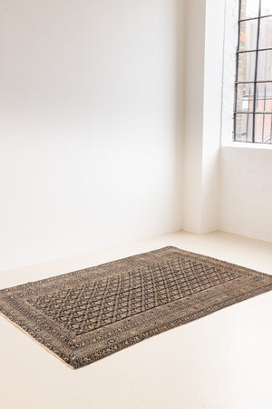 Liberty is a handmade Malayer rug, woven in the North West of Persia. This vintage carpet features a beautifully intricate repeating design and a rare colour palette.
