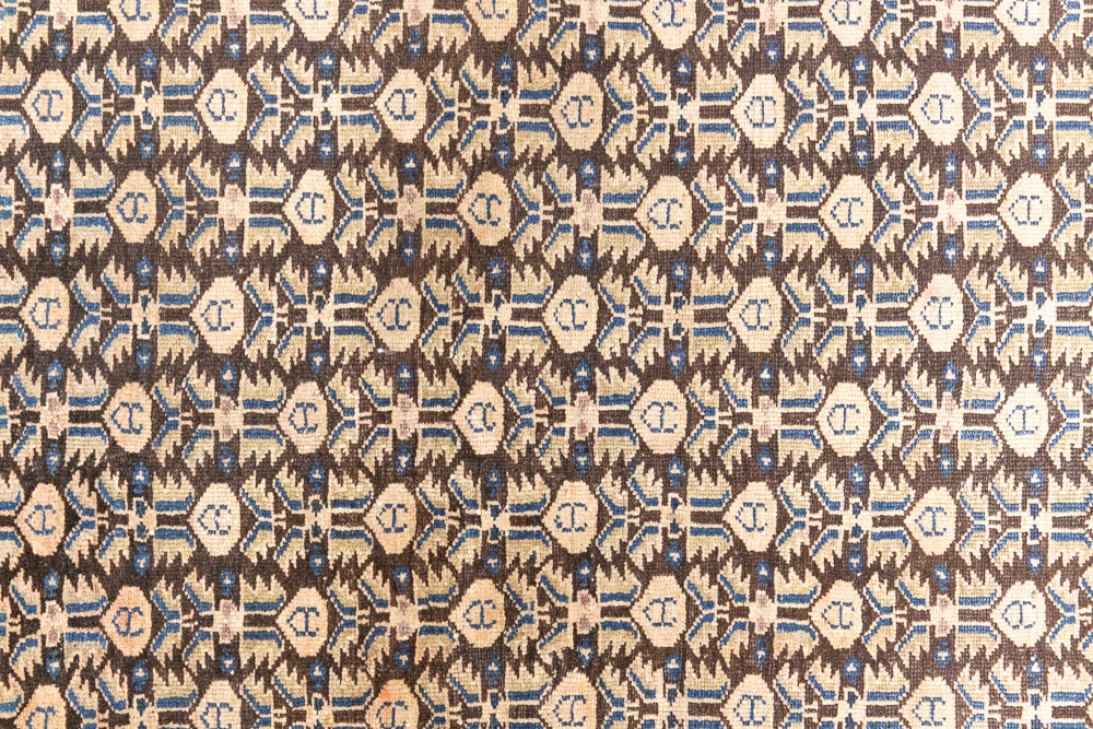 Liberty is a handmade Malayer rug, woven in the North West of Persia. This vintage carpet features a beautifully intricate repeating design and a rare colour palette.