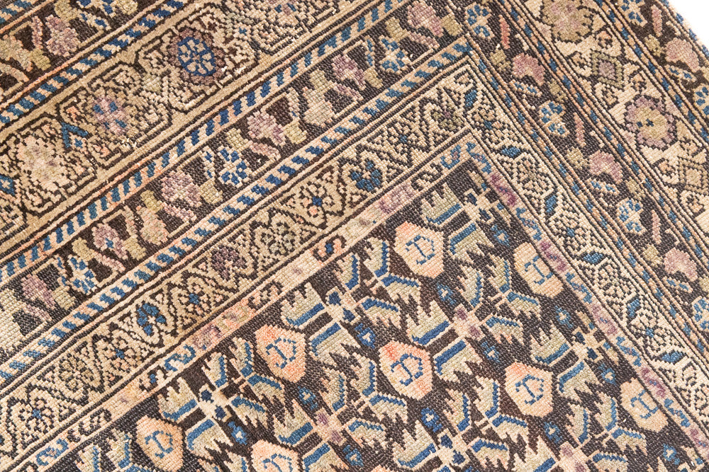 Liberty is a handmade Malayer rug, woven in the North West of Persia. This vintage carpet features a beautifully intricate repeating design and a rare colour palette.