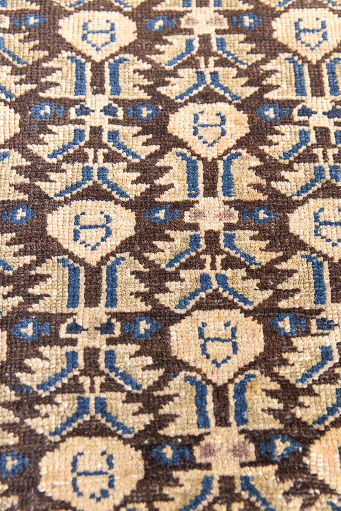 Liberty is a handmade Malayer rug, woven in the North West of Persia. This vintage carpet features a beautifully intricate repeating design and a rare colour palette.