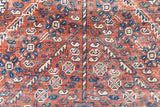 A Qashqai carpet. Sydney features a striking central diamond medallion, a classic motif in Qashqai weaving, framed by a repeating floral, boteh and gul pattern.