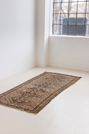 This a Vintage Persian Rug from Qashqai in Persia. This hand woven Carpet features a lovely pink and dark brown colour palette with a central medallion design.