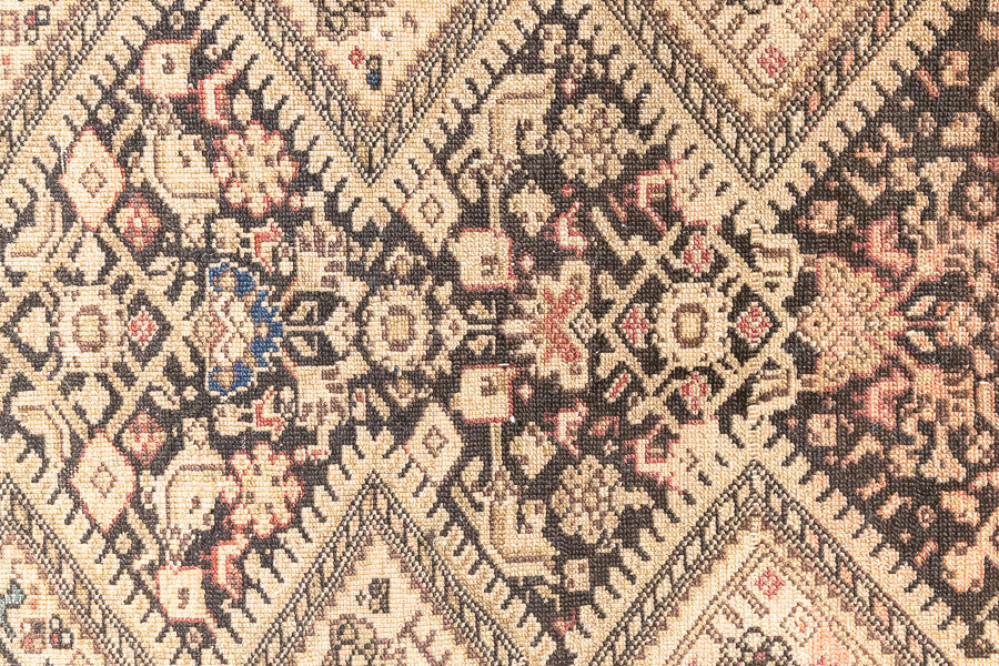 This a Vintage Persian Rug from Qashqai in Persia. This hand woven Carpet features a lovely pink and dark brown colour palette with a central medallion design.