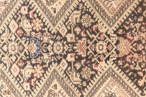 This a Vintage Persian Rug from Qashqai in Persia. This hand woven Carpet features a lovely pink and dark brown colour palette with a central medallion design.