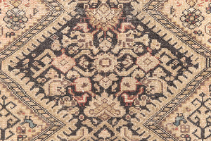 This a Vintage Persian Rug from Qashqai in Persia. This hand woven Carpet features a lovely pink and dark brown colour palette with a central medallion design.