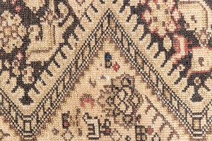 This a Vintage Persian Rug from Qashqai in Persia. This hand woven Carpet features a lovely pink and dark brown colour palette with a central medallion design.