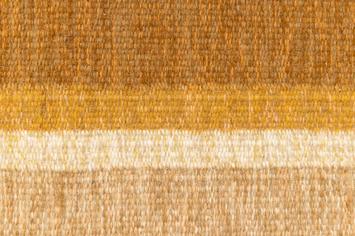 Kaia is a signed vintage Swedish flatweave rug by Ingegerd Silow, featuring a warm ochre field centred framed by stylised florals