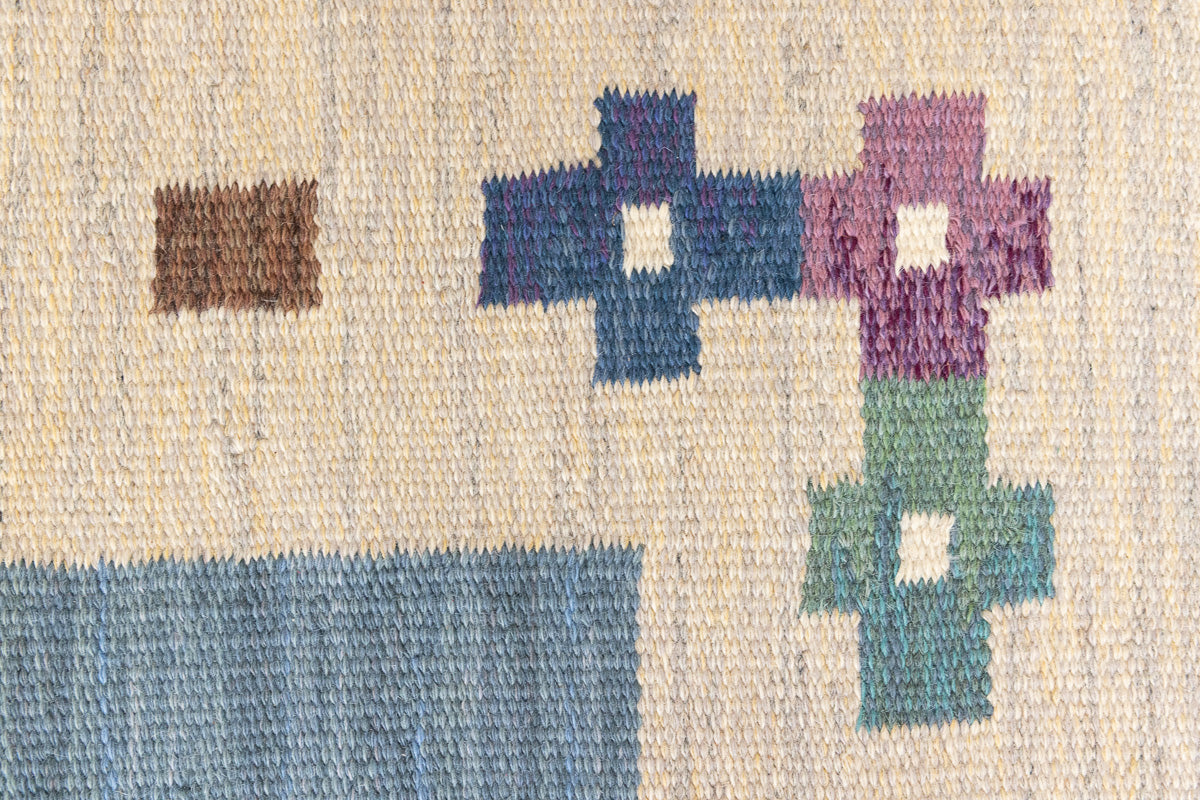 Lumi is a signed vintage Swedish flatweave rug by Anna-Greta Sjöqvist, featuring a calm blue field framed by ivory borders and delicate geometric motifs. Handwoven in wool using the traditional rölakan technique.