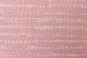 Kara is a vintage Swedish flatweave rug by Ingegerd Silow, featuring a soft pink field, denim blue ground and a pretty and stylised floral border. A leading figure in mid-century Swedish textile design, Silow is known for balancing traditional Nordic craftsmanship with a more decorative, expressive sensibility. This vintage rug features this signature style in its subtle yet playful floral border set against a calm field.