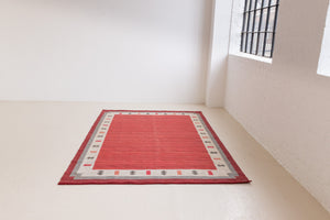 Tuva is a vintage rug handwoven in Sweden by the textile designer Ingegerd Silow. This piece features a rare red ground and sought after design.