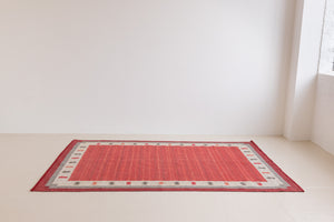 Tuva is a vintage rug handwoven in Sweden by the textile designer Ingegerd Silow. This piece features a rare red ground and sought after design.