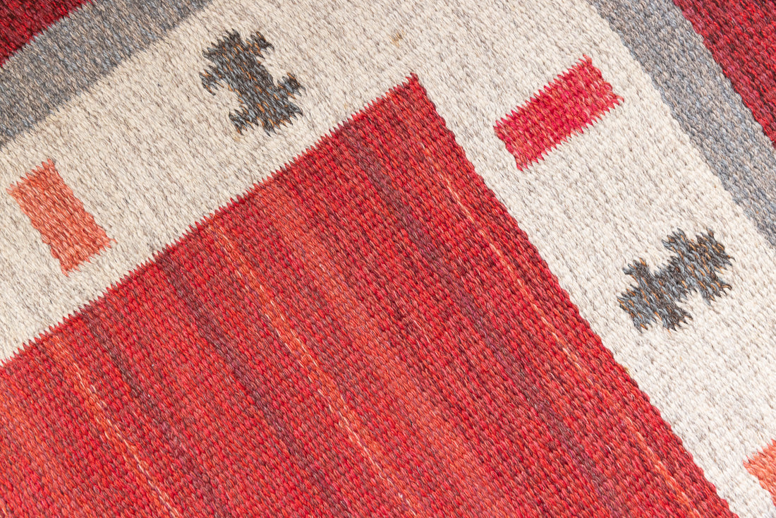 Tuva is a vintage rug handwoven in Sweden by the textile designer Ingegerd Silow. This piece features a rare red ground and sought after design.