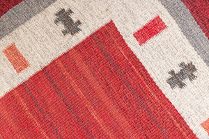 Tuva is a vintage rug handwoven in Sweden by the textile designer Ingegerd Silow. This piece features a rare red ground and sought after design.