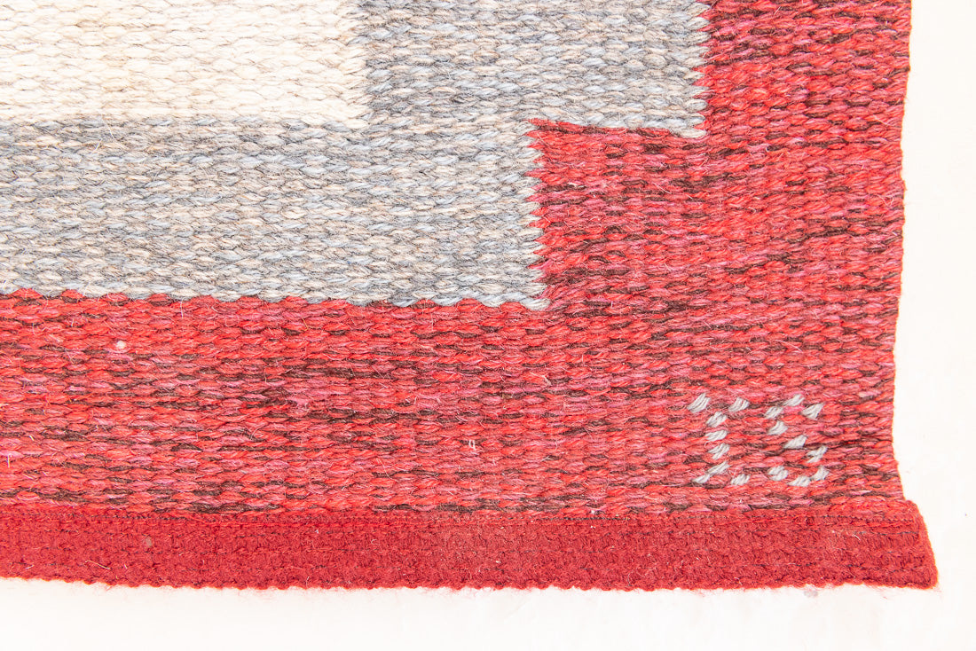 Tuva is a vintage rug handwoven in Sweden by the textile designer Ingegerd Silow. This piece features a rare red ground and sought after design.