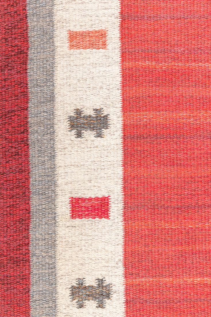 Tuva is a vintage rug handwoven in Sweden by the textile designer Ingegerd Silow. This piece features a rare red ground and sought after design.