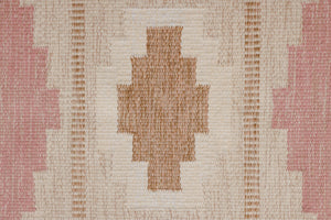 Trina is an original Swedish röllakan rug handwoven by the mid-century textile designer Anna Johanna Angström. This vintage rug features geometric designs in pink, blue, and brown on a beige ground.