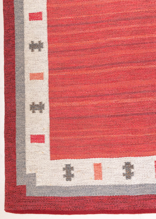 Tuva is a vintage rug handwoven in Sweden by the textile designer Ingegerd Silow. This piece features a rare red ground and sought after design.