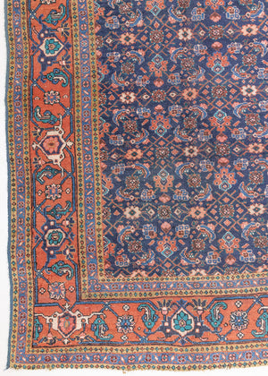 This a Vintage Persian Rug from Heriz in Persia. This hand woven Carpet features a lovely rust red and khaki green colour palette with a central medallion design.