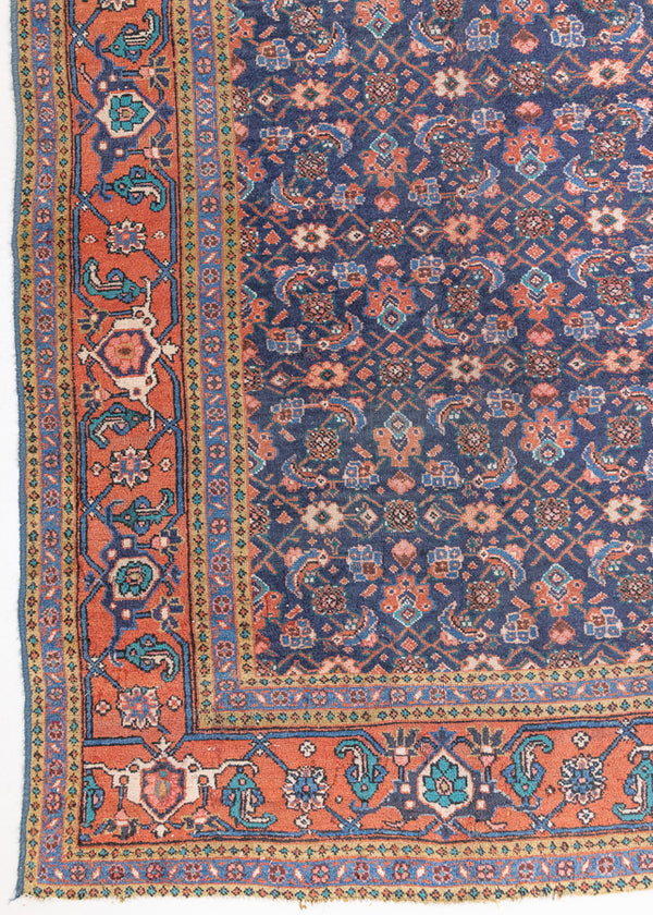 This a Vintage Persian Rug from Heriz in Persia. This hand woven Carpet features a lovely rust red and khaki green colour palette with a central medallion design.