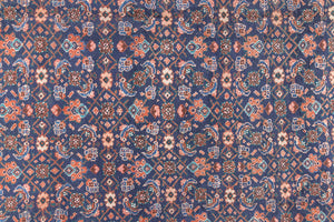 This a Vintage Persian Rug from Heriz in Persia. This hand woven Carpet features a lovely rust red and khaki green colour palette with a central medallion design.