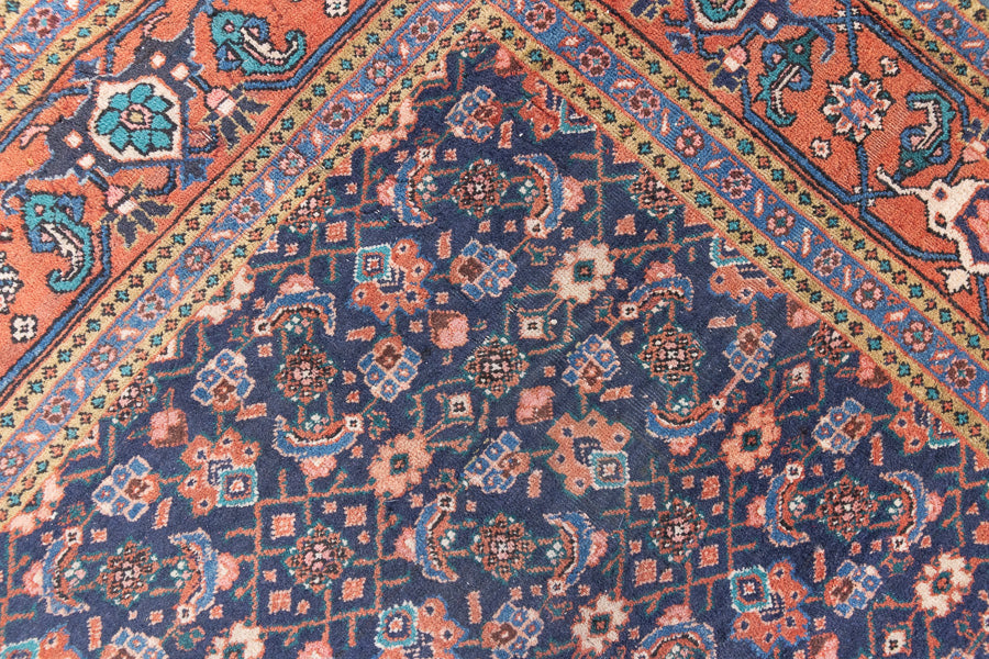 This a Vintage Persian Rug from Heriz in Persia. This hand woven Carpet features a lovely rust red and khaki green colour palette with a central medallion design.