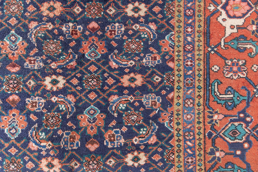 This a Vintage Persian Rug from Heriz in Persia. This hand woven Carpet features a lovely rust red and khaki green colour palette with a central medallion design.