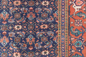 This a Vintage Persian Rug from Heriz in Persia. This hand woven Carpet features a lovely rust red and khaki green colour palette with a central medallion design.