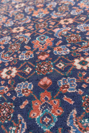 This a Vintage Persian Rug from Heriz in Persia. This hand woven Carpet features a lovely rust red and khaki green colour palette with a central medallion design.