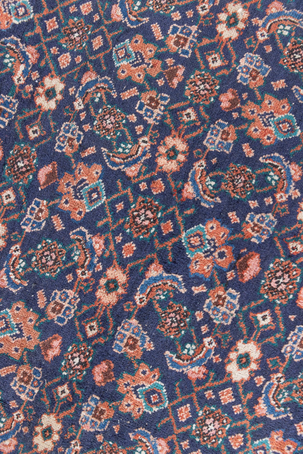 This a Vintage Persian Rug from Heriz in Persia. This hand woven Carpet features a lovely rust red and khaki green colour palette with a central medallion design.