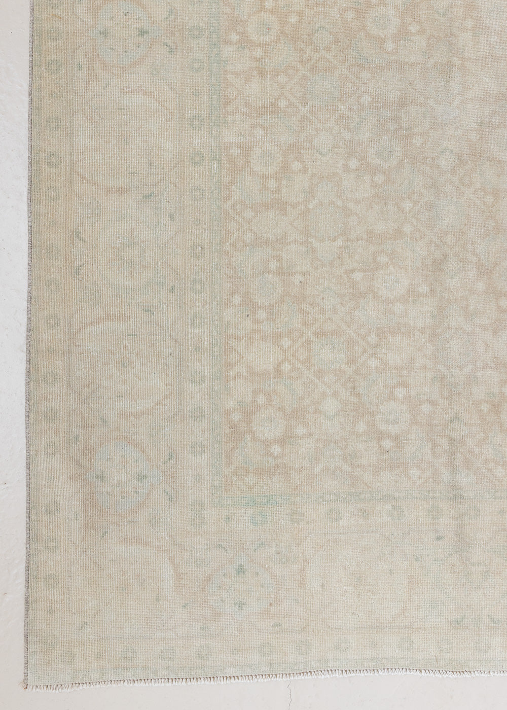 Misty is an antique Persian Tabriz rug which has been over-dyed using a special technique to gently fade its original colours, creating a stunning soft palette on this handwoven carpet from Persia.