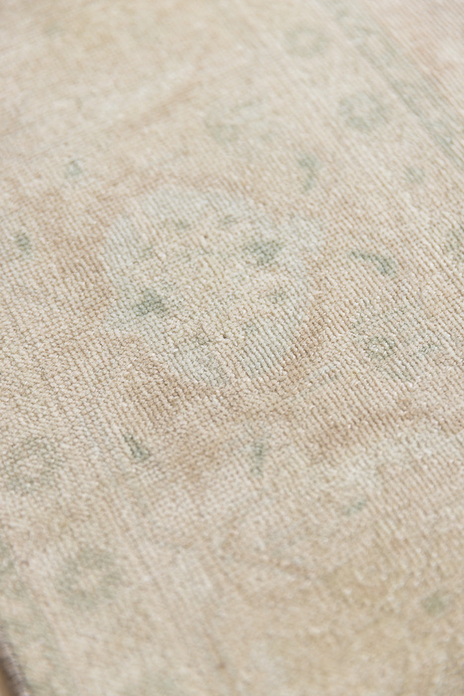 Misty is an antique Persian Tabriz rug which has been over-dyed using a special technique to gently fade its original colours, creating a stunning soft palette on this handwoven carpet from Persia.