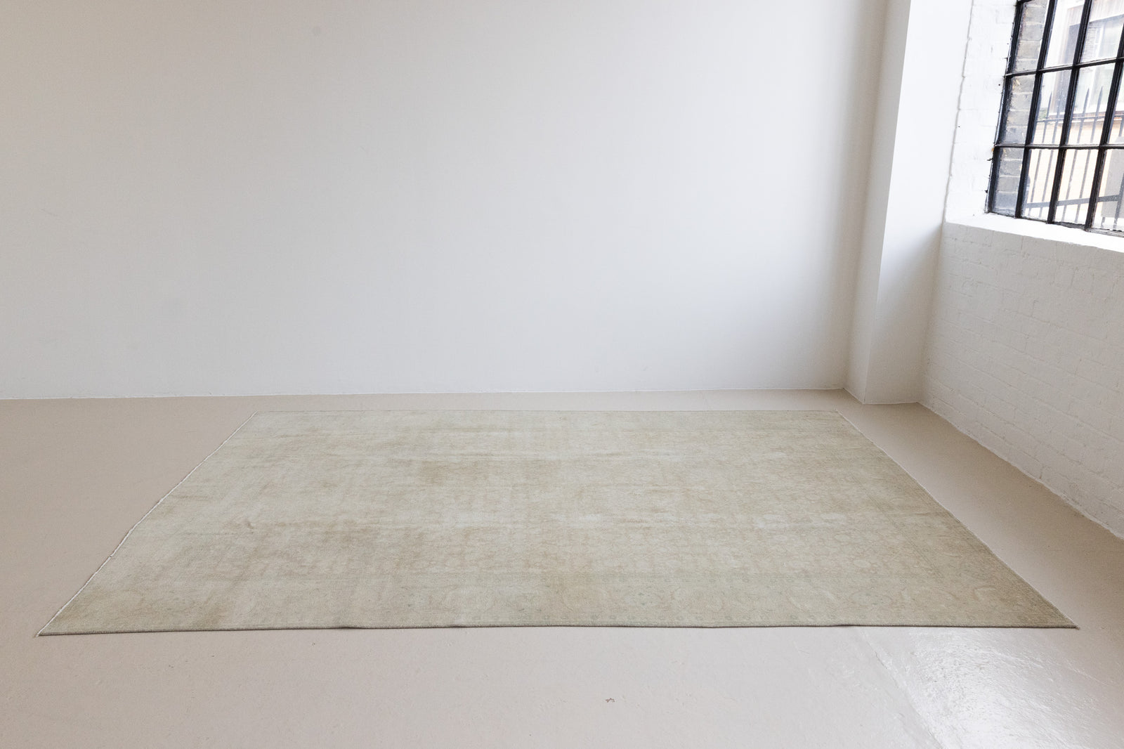 Misty is an antique Persian Tabriz rug which has been over-dyed using a special technique to gently fade its original colours, creating a stunning soft palette on this handwoven carpet from Persia.