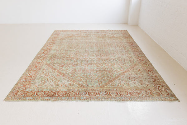 This is a Persian Mahal rug with a beautiful palette of reds oranges blues and a wonderful patina with lovely natural wear. Mahal in Persia produces the finest of carpets and this is one of them.