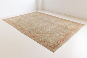 This is a Persian Mahal rug with a beautiful palette of reds oranges blues and a wonderful patina with lovely natural wear. Mahal in Persia produces the finest of carpets and this is one of them.