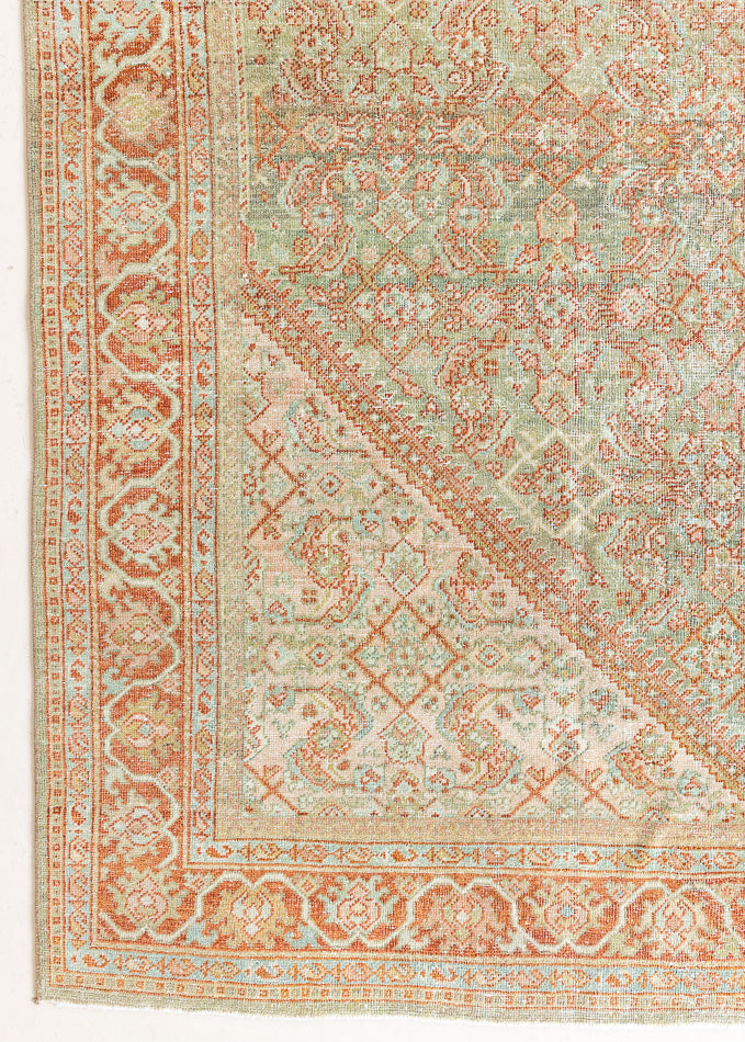 This is a Persian Mahal rug with a beautiful palette of reds oranges blues and a wonderful patina with lovely natural wear. Mahal in Persia produces the finest of carpets and this is one of them.