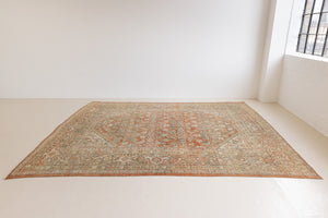 This is a Persian Mahal rug with a beautiful palette of reds oranges blues and a wonderful patina with lovely natural wear. Mahal in Persia produces the finest of carpets and this is one of them.