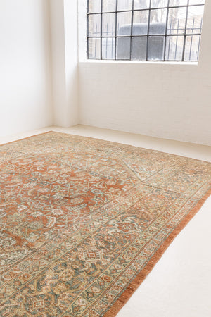 This is a Persian Mahal rug with a beautiful palette of reds oranges blues and a wonderful patina with lovely natural wear. Mahal in Persia produces the finest of carpets and this is one of them.