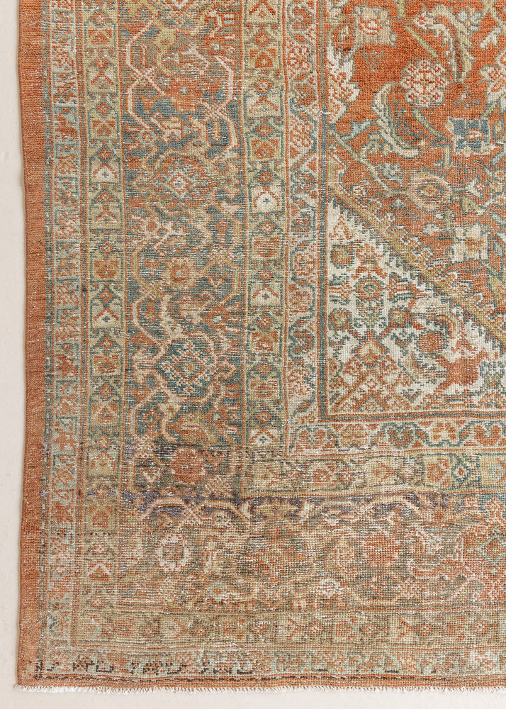 This is a Persian Mahal rug with a beautiful palette of reds oranges blues and a wonderful patina with lovely natural wear. Mahal in Persia produces the finest of carpets and this is one of them.