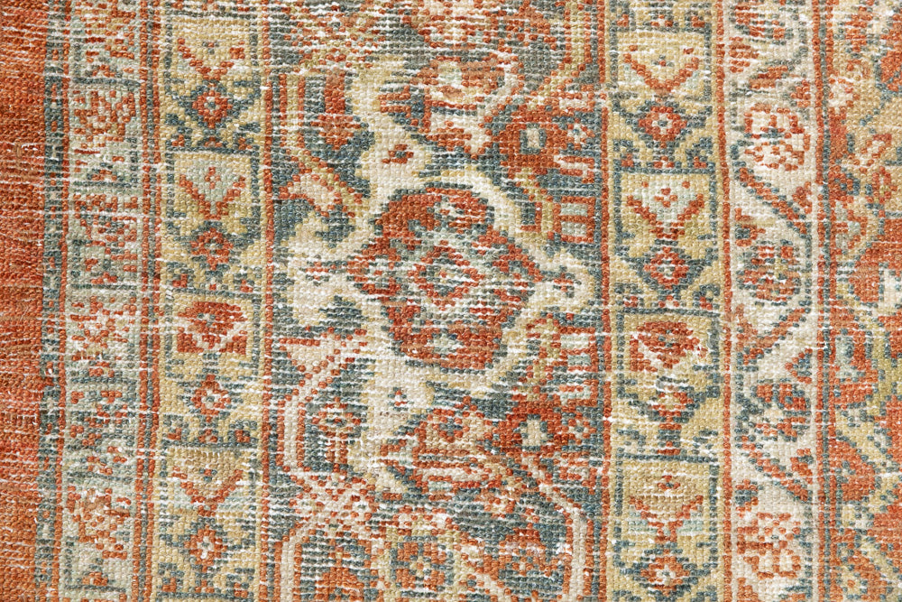 This is a Persian Mahal rug with a beautiful palette of reds oranges blues and a wonderful patina with lovely natural wear. Mahal in Persia produces the finest of carpets and this is one of them.