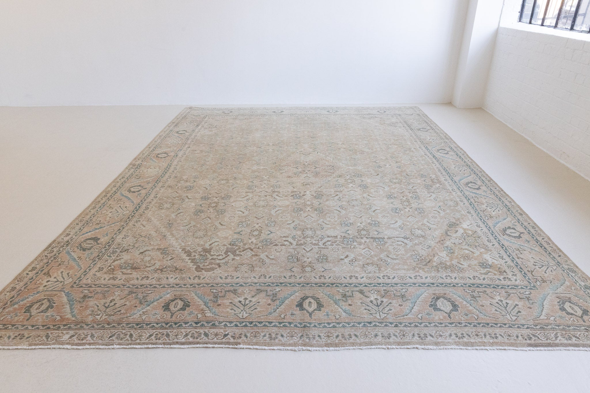 Handwoven antique Persian carpet with a muted taupe field and a decorative all-over floral design